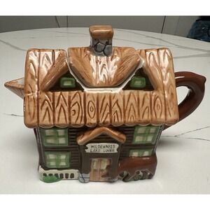 Vintage Wilderness Lake lodge teapot cabin, deer, fishing, canoes by Designpac.